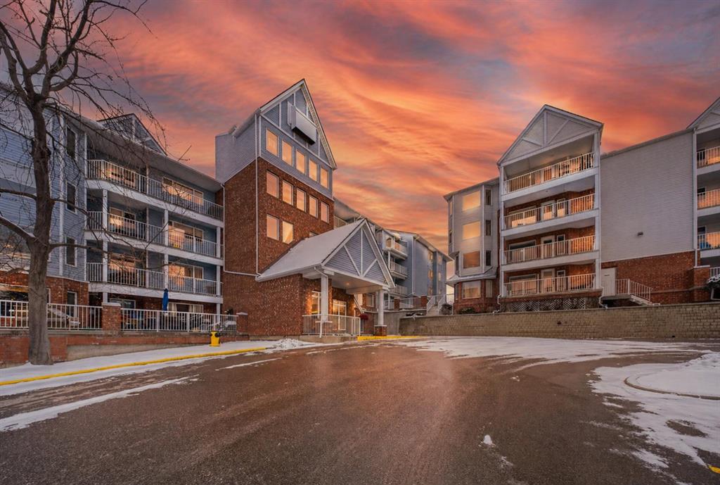 Exterior view of Dream View Village condominium at 3402 Hawksbrow Point NW in Hawkwood, Calgary