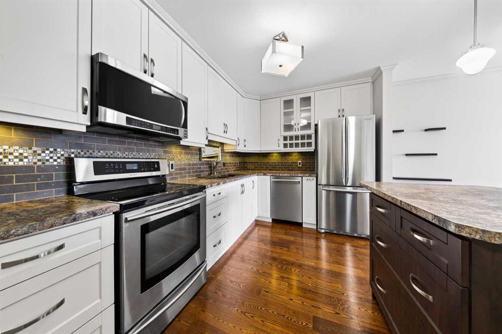 Kitchen with stainless steel appliances and hardwood flooring