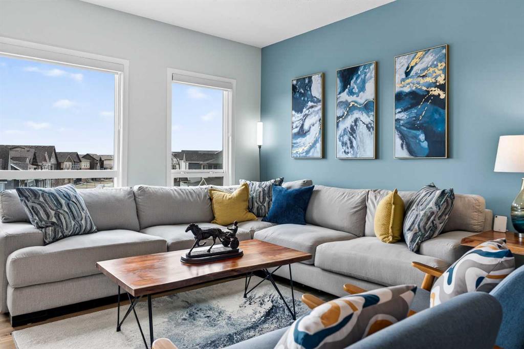 Sectional sofa in living room with feature wall art and natural light